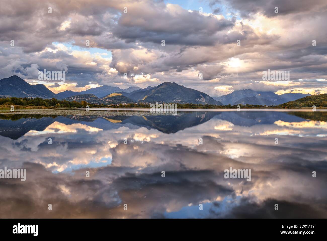Cloudscape - Sunset chaos over the lake Alserio, Como, Lombardy, Italy Stock Photo