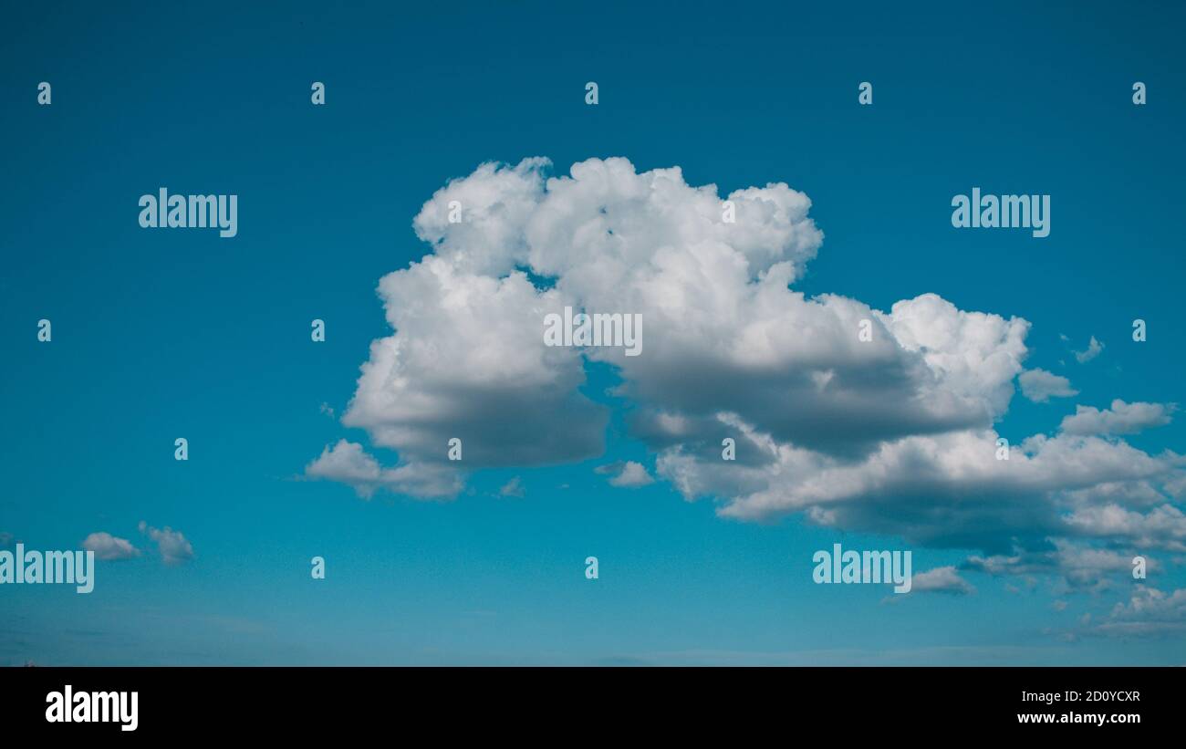Beautiful isolated cloud in the blue sky (Corinaldo, Marche, Italy, Europe) Stock Photo