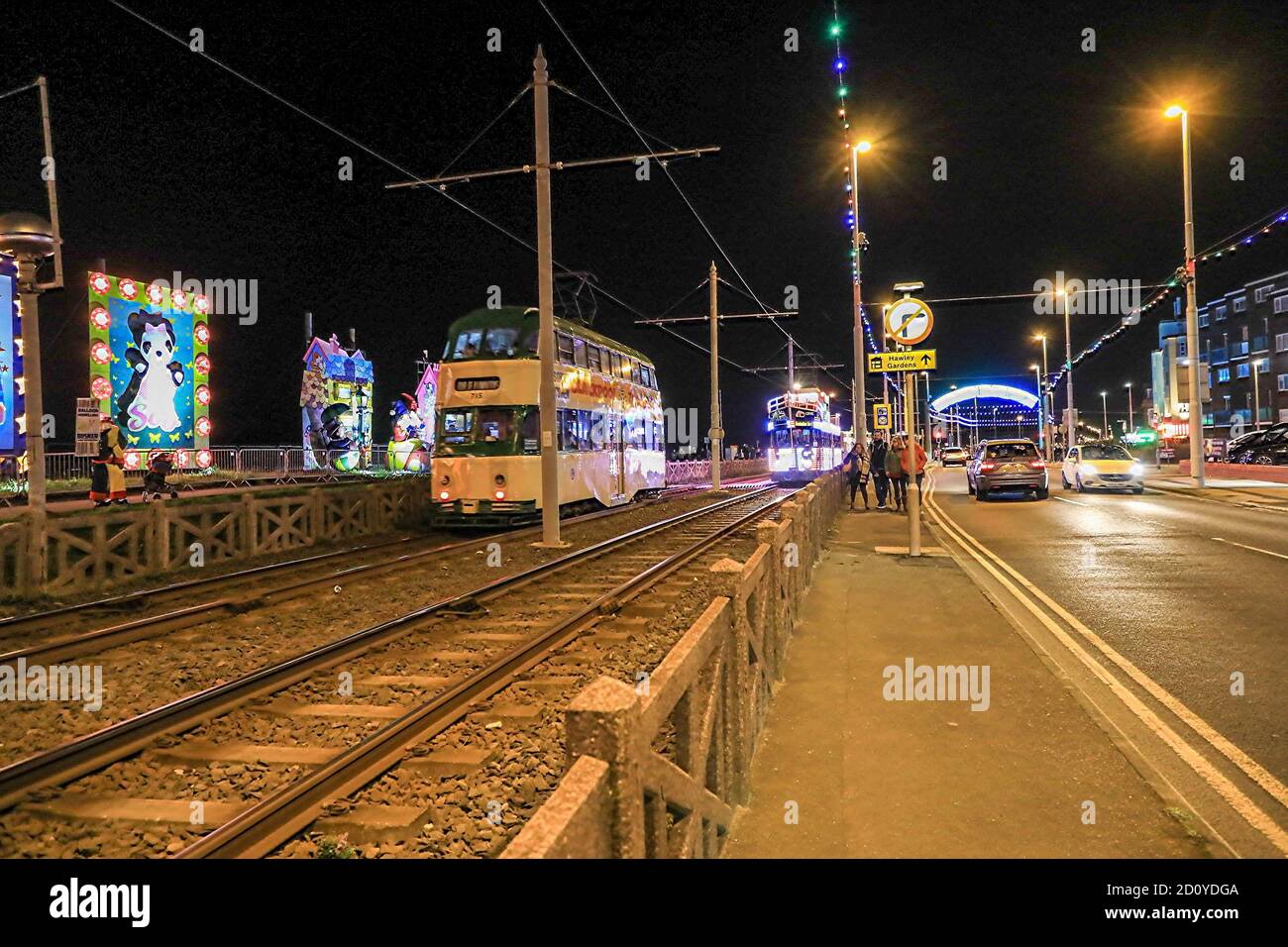 An heritage tram on the seafront at night time, Blackpool, Lancashire, England, UK Stock Photo