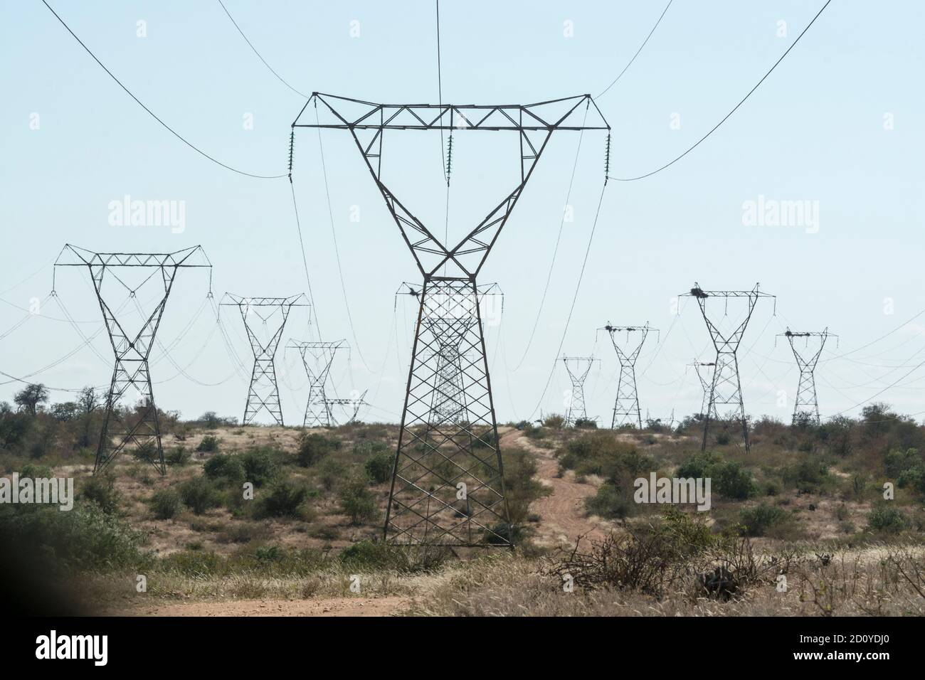 Power lines serried ranks of pylons/masts carrying high voltage