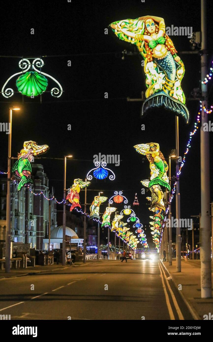 A street scene on the north promenade at night time at Blackpool Illuminations, Blackpool, Lancashire, England, UK Stock Photo