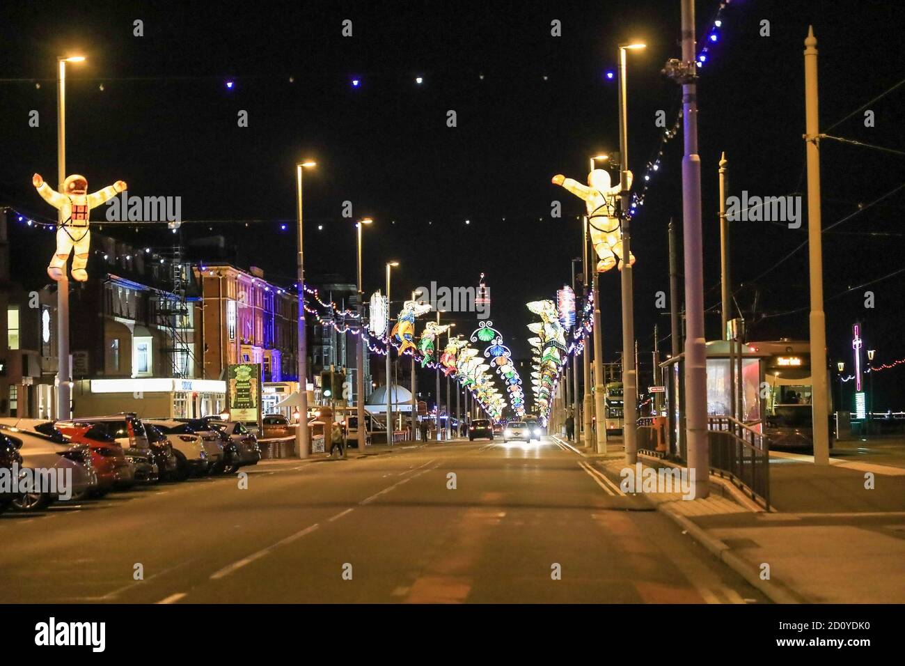 A street scene on the north promenade at night time at Blackpool Illuminations, Blackpool, Lancashire, England, UK Stock Photo
