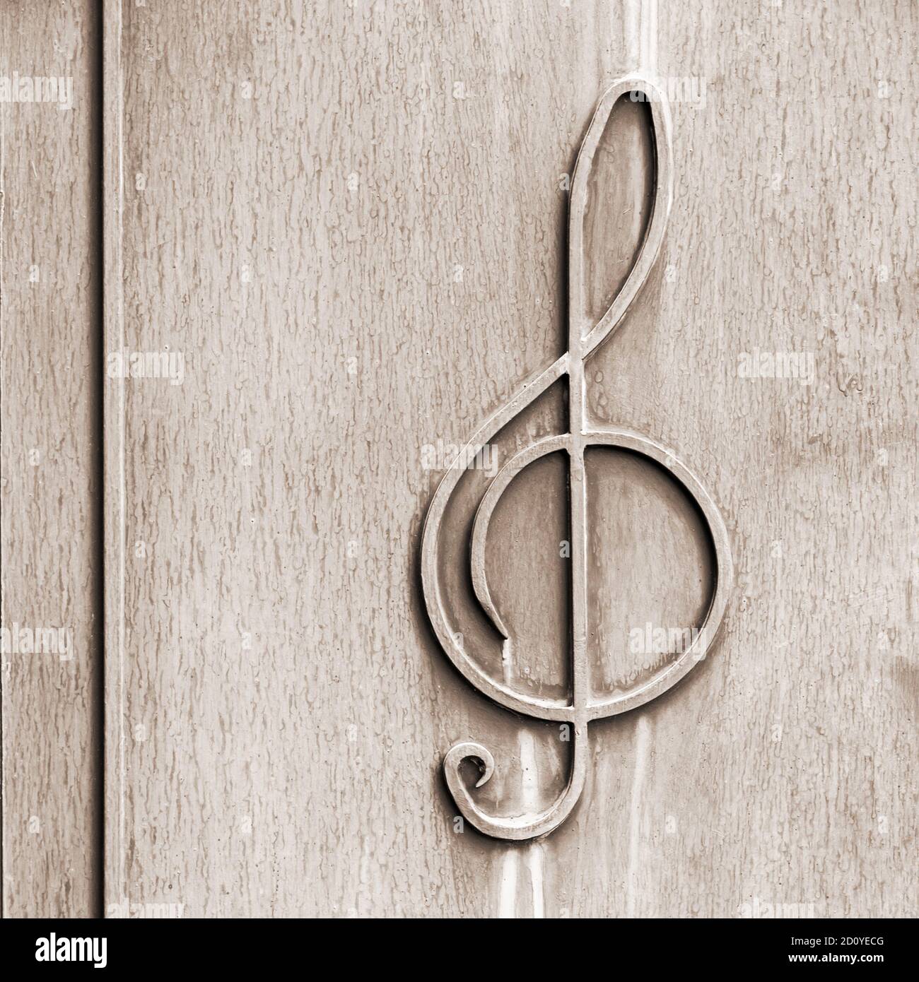 treble clef - on the old textured metal surface Stock Photo