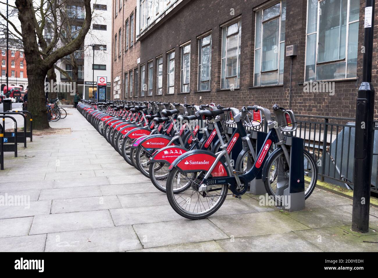 dh Bicycle stand CITY LONDON ENGLAND UK Street parked pushbikes for hire england bikehire bikes bicycles parking rank rack Stock Photo