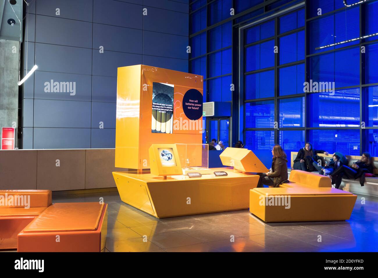 dh  SCIENCE MUSEUM LONDON People teenage children operating battery technology display inside england uk child exhibit Stock Photo