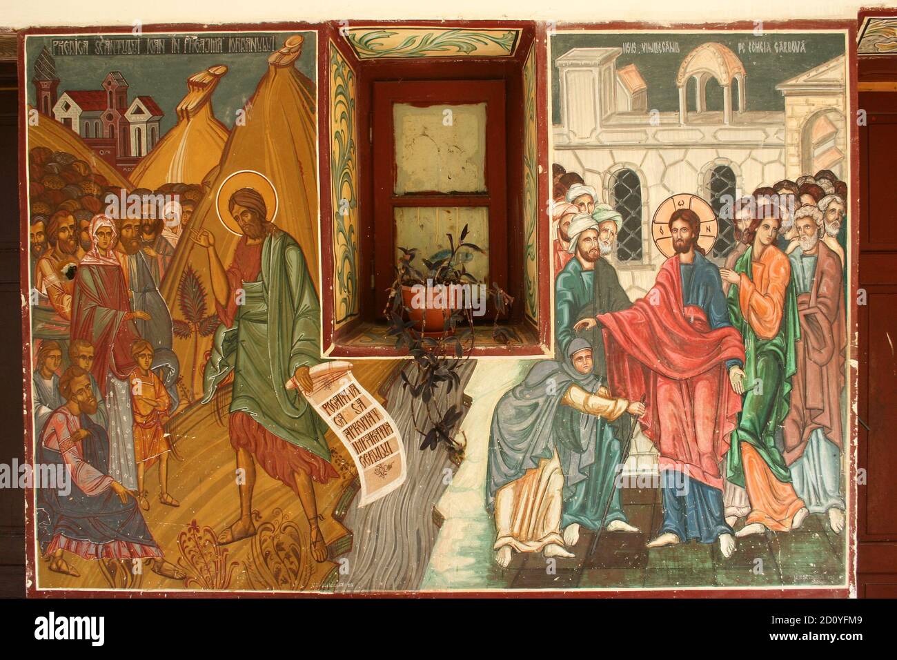 Caldarusani Monastery, Ilfov County, Romania. Frescoes depicting Jesus healing the crippled woman (right) and John the Baptist preaching (left). Stock Photo