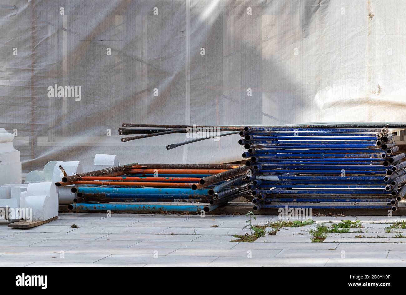 Small construction site. Cement blocks and pipes on the ground, ready