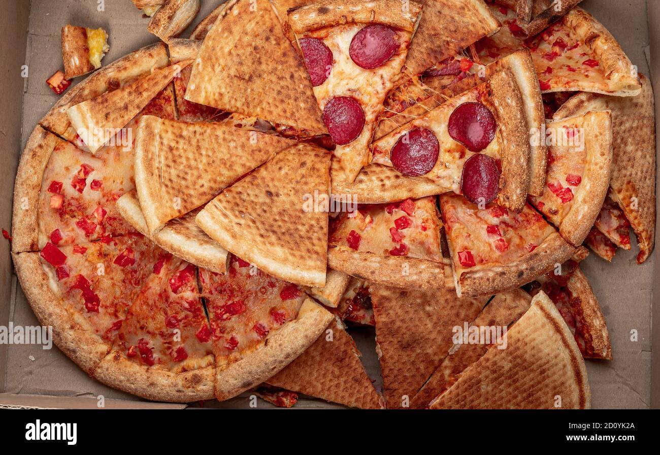 pizza food dumped in trash Stock Photo