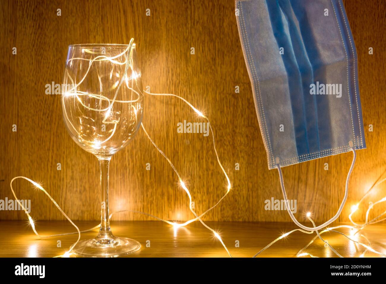 Fairy lights with Surgical mask indicating Coronavirus Christmas Stock Photo