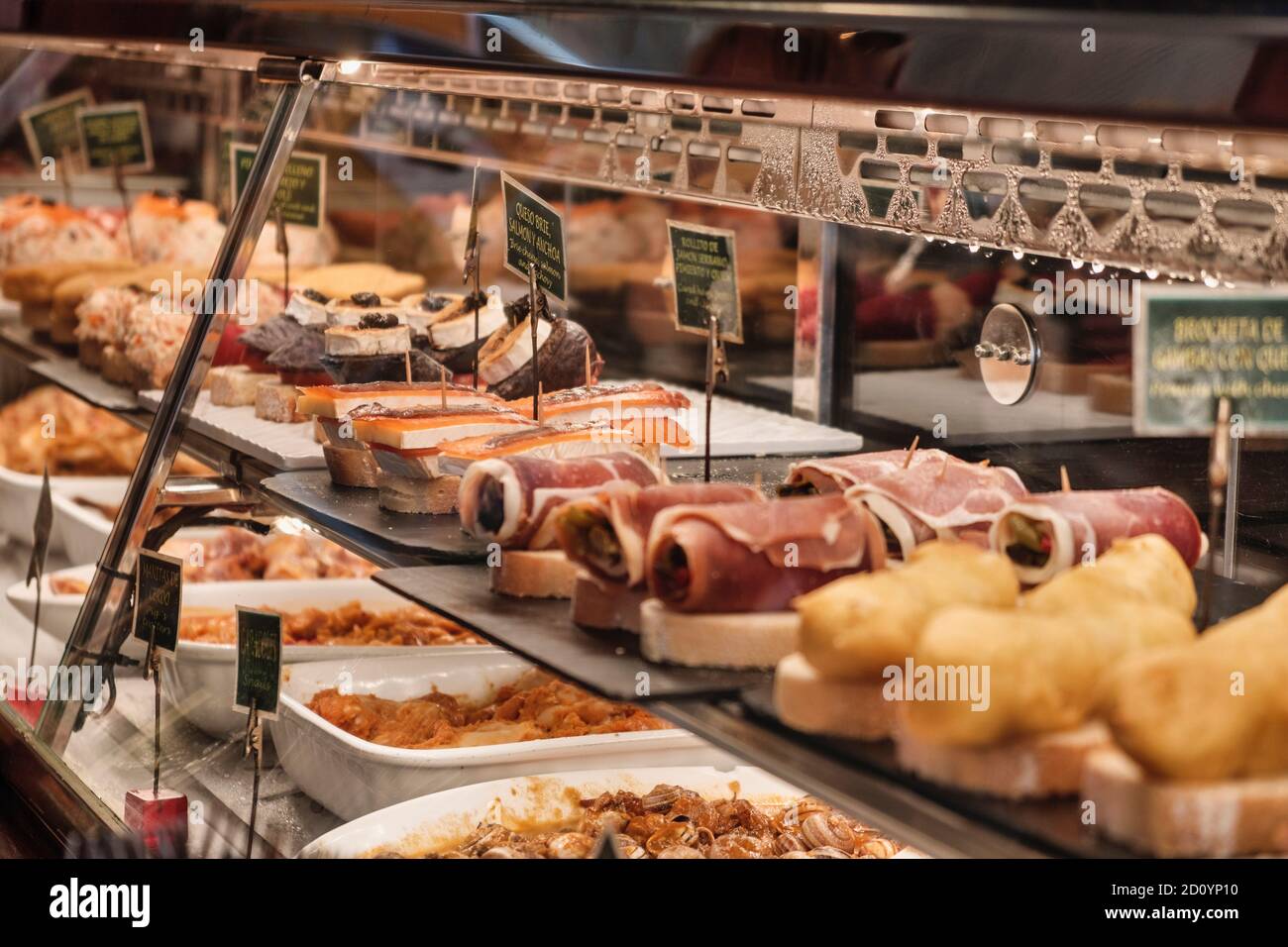 Benidorm, Alicante Province, Spain October 5, 2019, Tapas in the showcase of the tapas bar 'Cava Aragonesa' in the Calle Santo Domingo in the old town Stock Photo