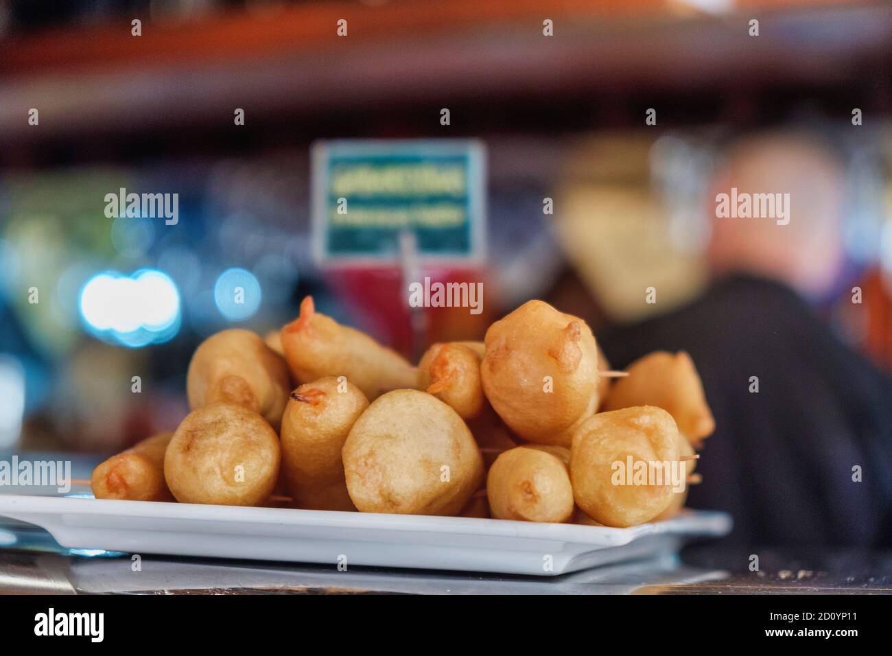 Benidorm, Alicante Province, Spain October 5, 2019, Langustinos in batter on the showcase of the tapas bar 'Cava Aragonesa' in the Calle Santo Domingo in the old town Stock Photo