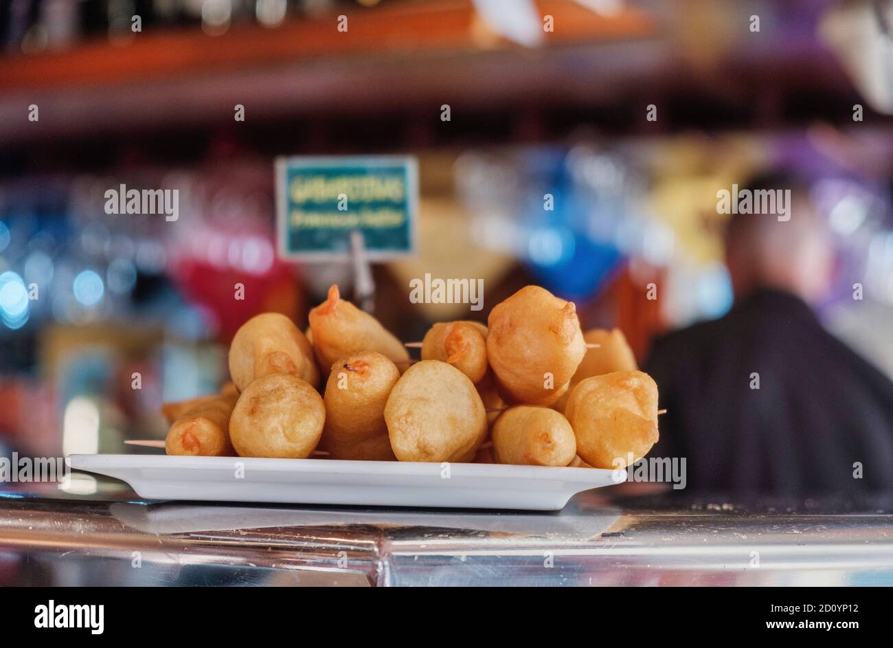 Benidorm, Alicante Province, Spain October 5, 2019, Langustinos in batter on the showcase of the tapas bar 'Cava Aragonesa' in the Calle Santo Domingo in the old town Stock Photo