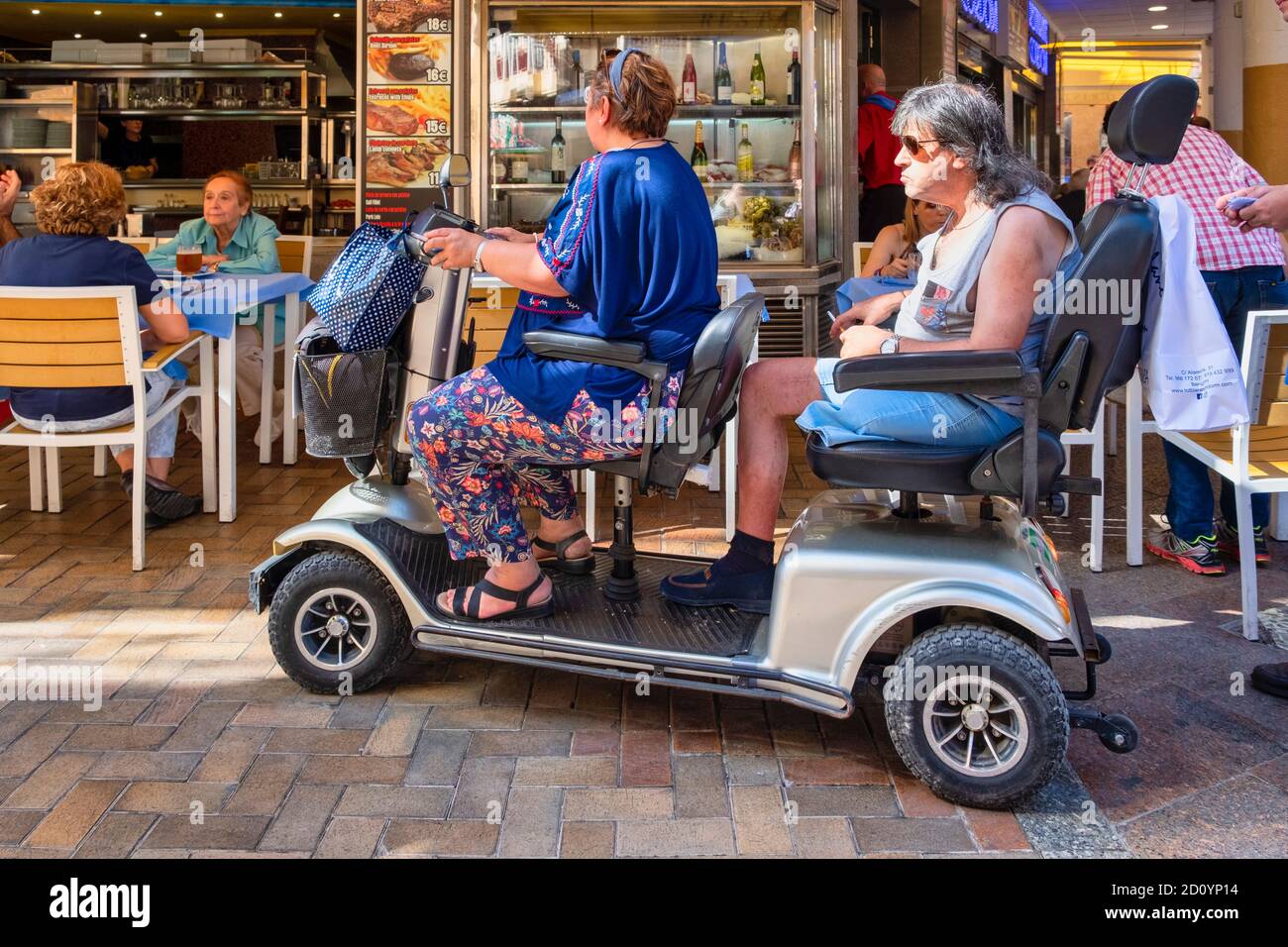 Benidorm, Alicante Province, Spain 5.10.2019, tourists on mobility scooters  in the old town Stock Photo - Alamy