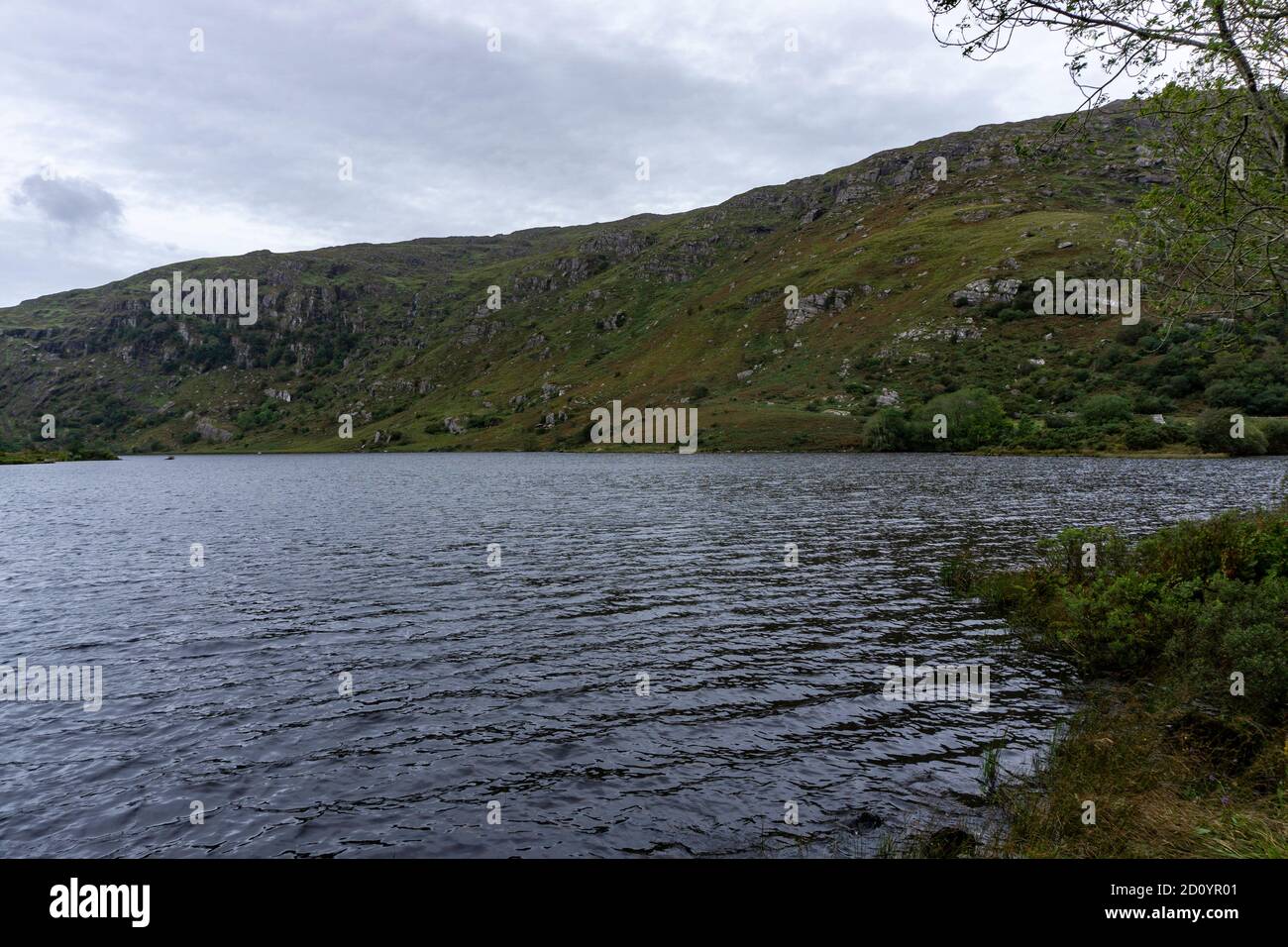 The lake in Googane Barra in Cork, Ireland. It is situated beside St Finbarr’s Oratory and church and surrounded by hills of natural beauty. Stock Photo