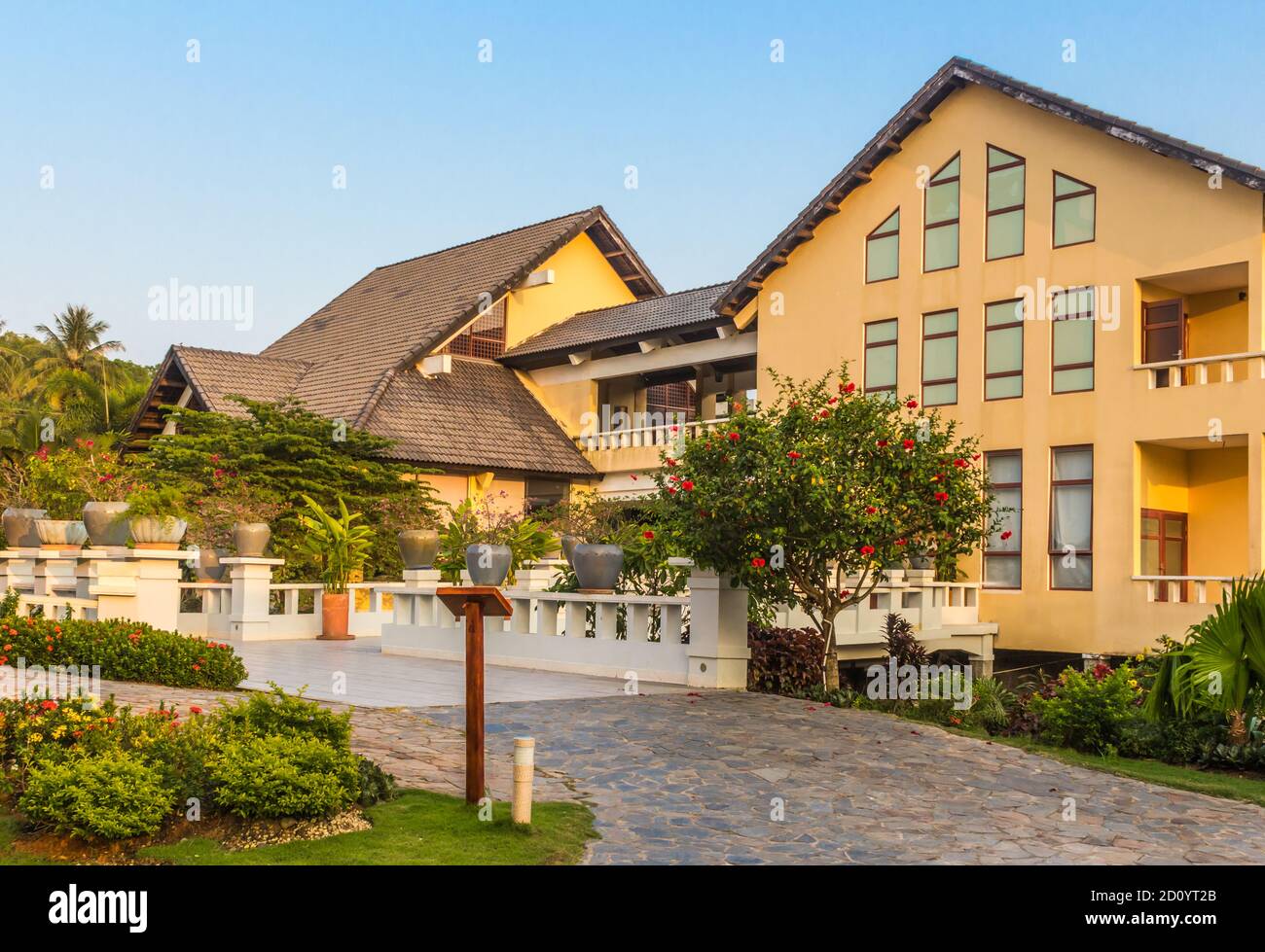 Vietnamese hotel building with garden in the evening Stock Photo Alamy
