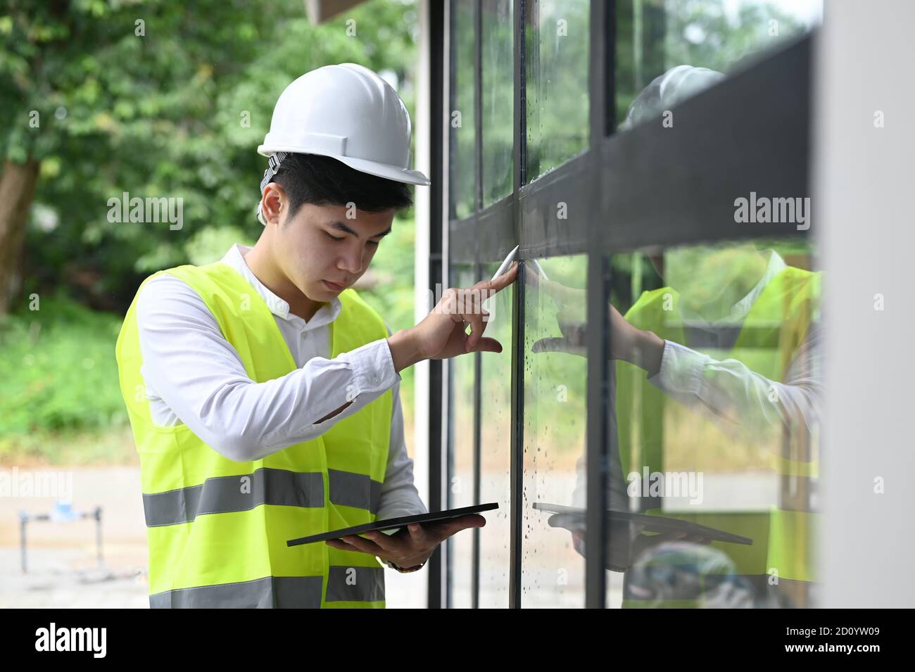 Building inspector checking with tablet at new property Stock Photo Alamy