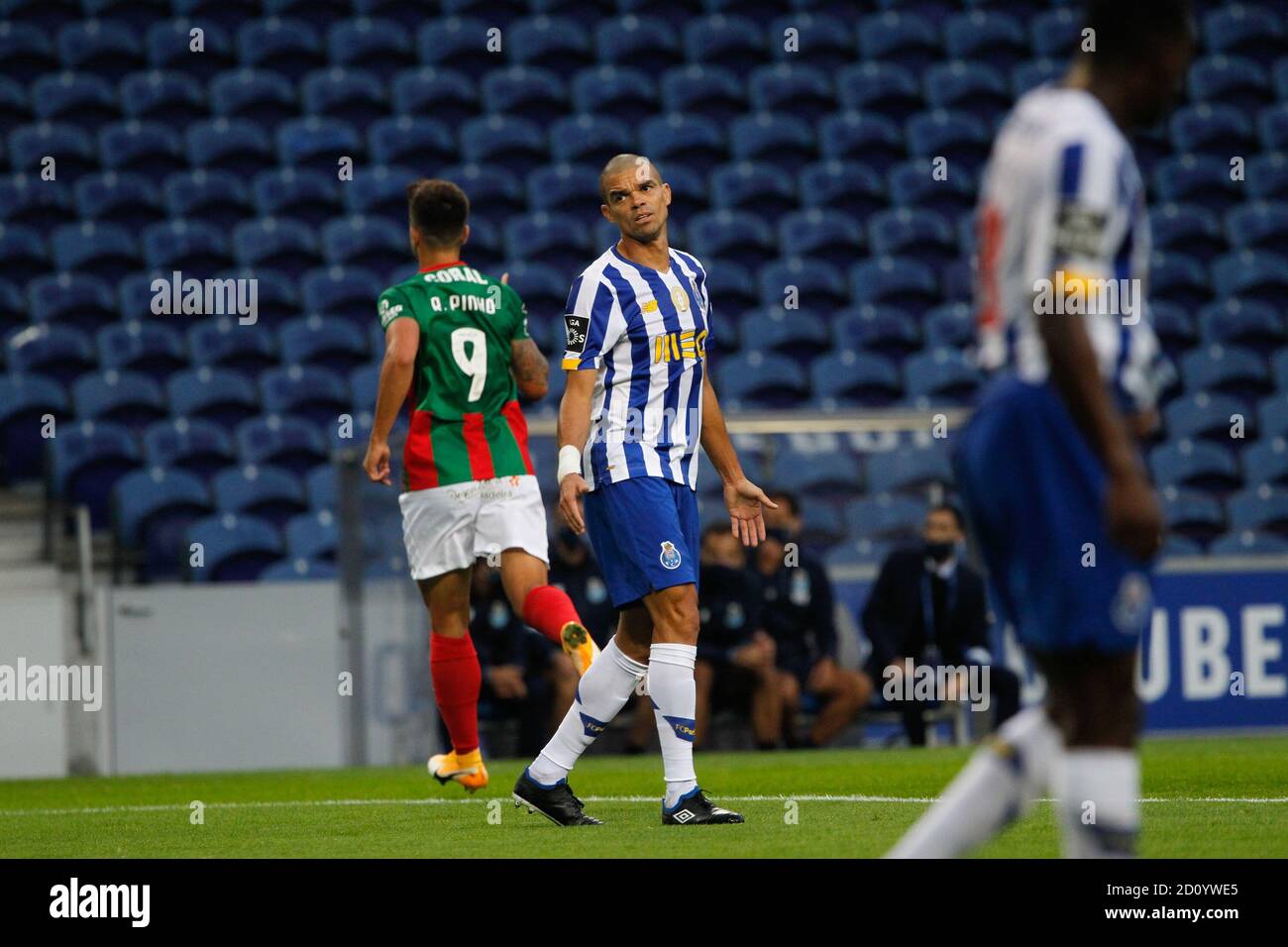 Pepe of Porto looks dejected as Rodrigo Pinho of Maritimo (L) celebrates his goal during the Portuguese championship, Liga NOS football match between Stock Photo