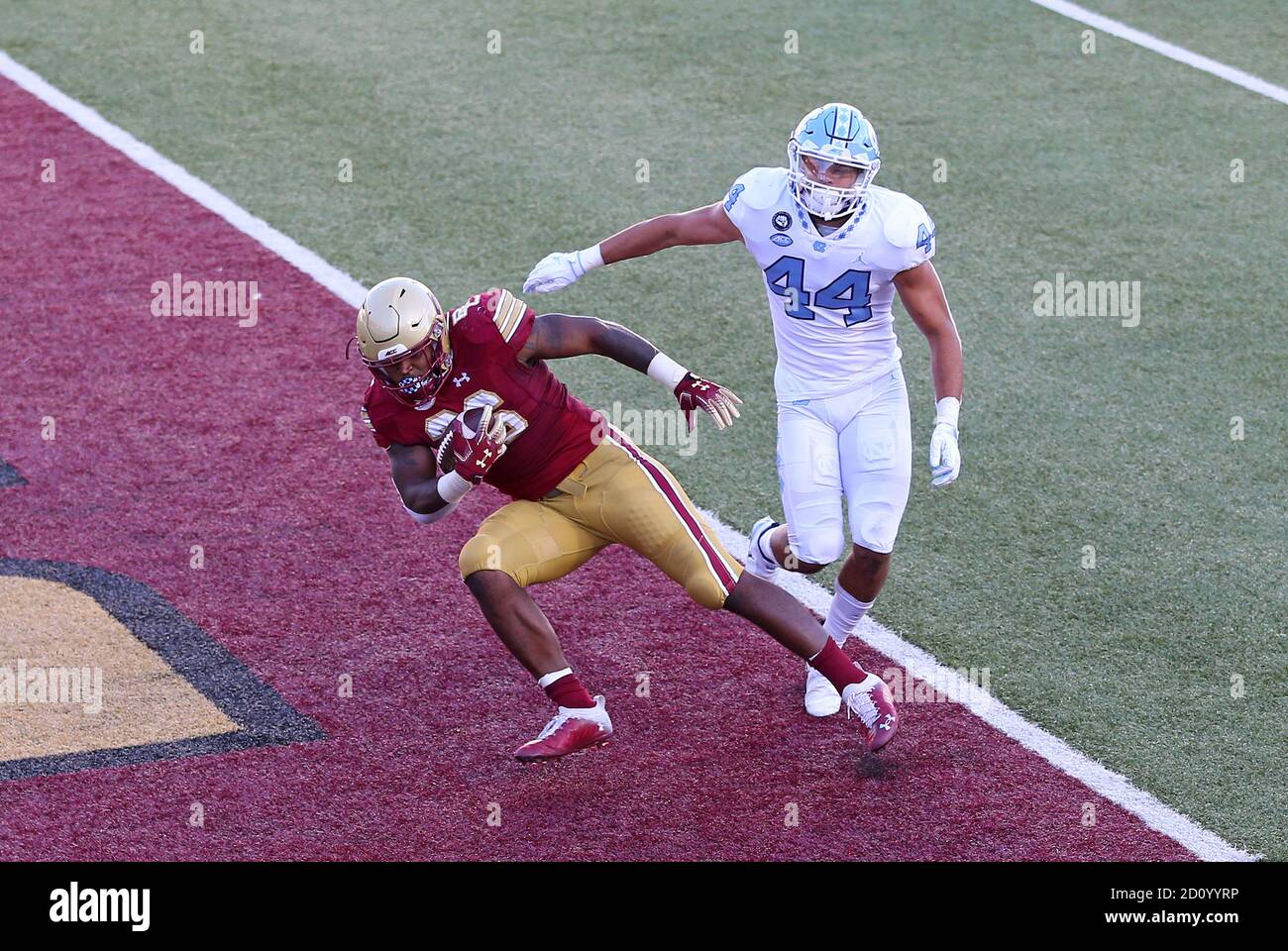 Alumni Stadium. 3rd Oct, 2020. MA, USA; Boston College Eagles running back David Bailey (26) scores a touchdown while defended by North Carolina Tar Heels linebacker Jeremiah Gemmel (44) during the NCAA football game between North Carolina Tar Heels and Boston College Eagles at Alumni Stadium. Anthony Nesmith/CSM/Alamy Live News Stock Photo