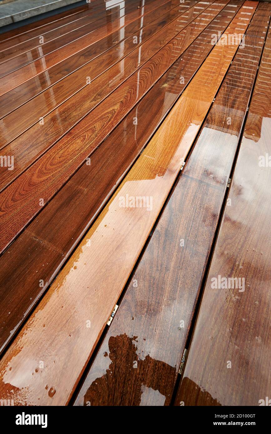 Wet hardwood floor on patio in exterior Stock Photo Alamy
