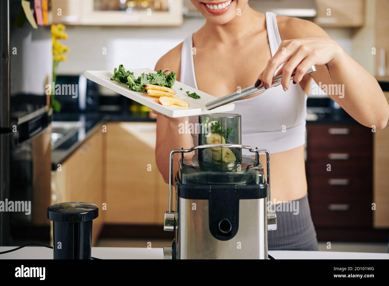 Woman making healthy juice Stock Photo