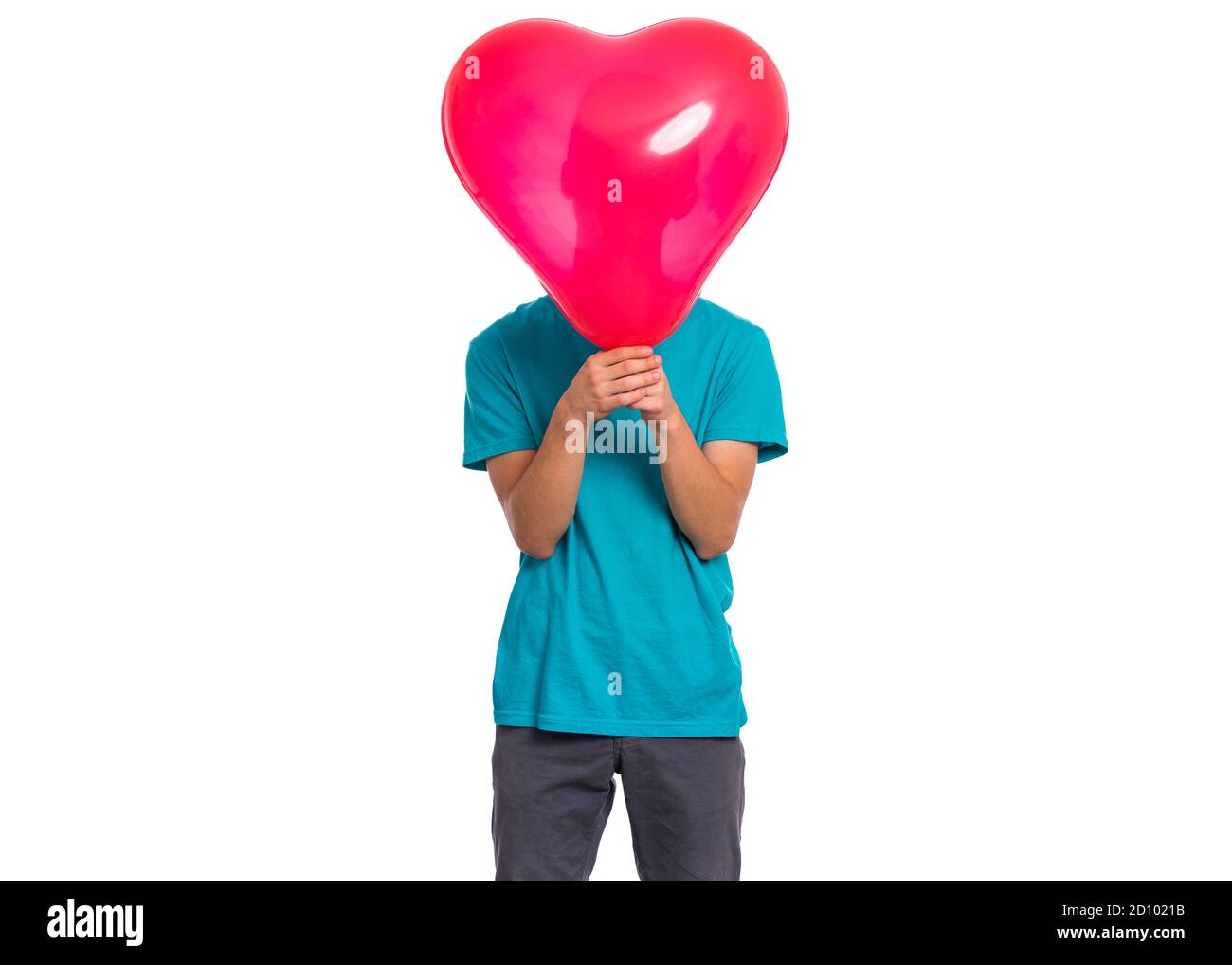 Boy with heart shaped balloon Stock Photo