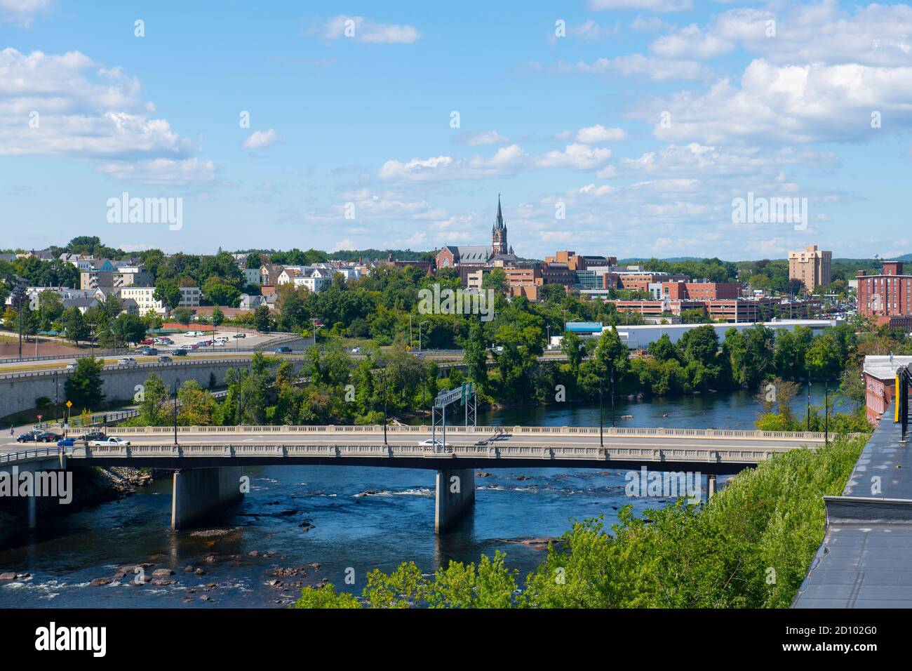 Manchester historic city skyline including Merrimack River, Granite Street Bridge and West Side Sainte Marie Parish church in Manchester, New Hampshir Stock Photo