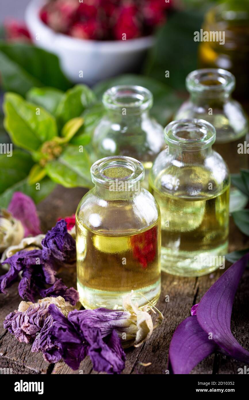Dried herbs with essential oils for aromatherapy treatment. Bottle of