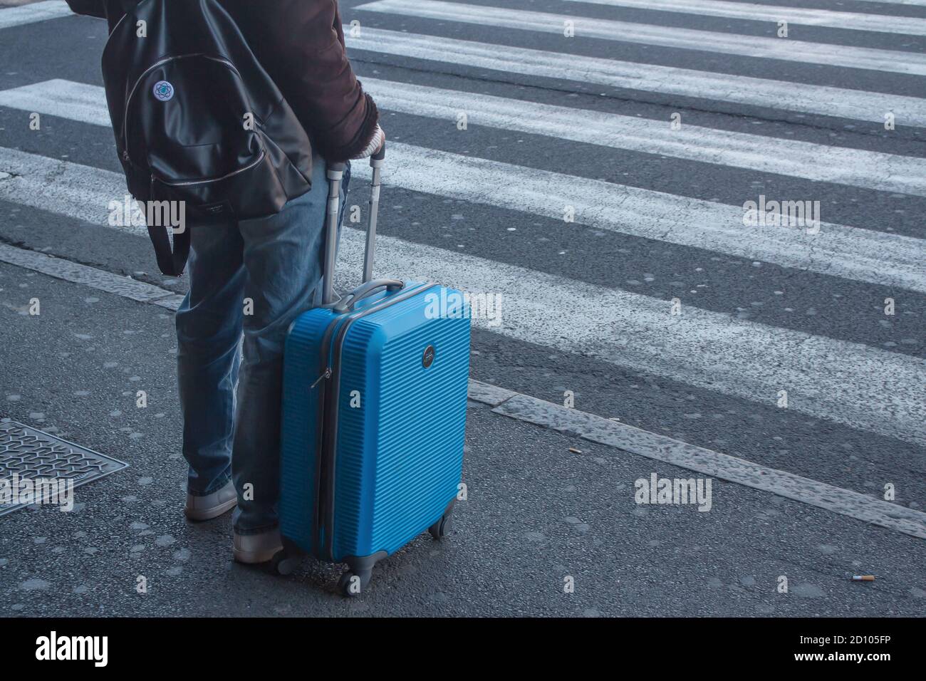 Bologna: A girl with a suitcase is leaving before the total lockdown in Italy. (Covid-19 pandemic 2020) Stock Photo