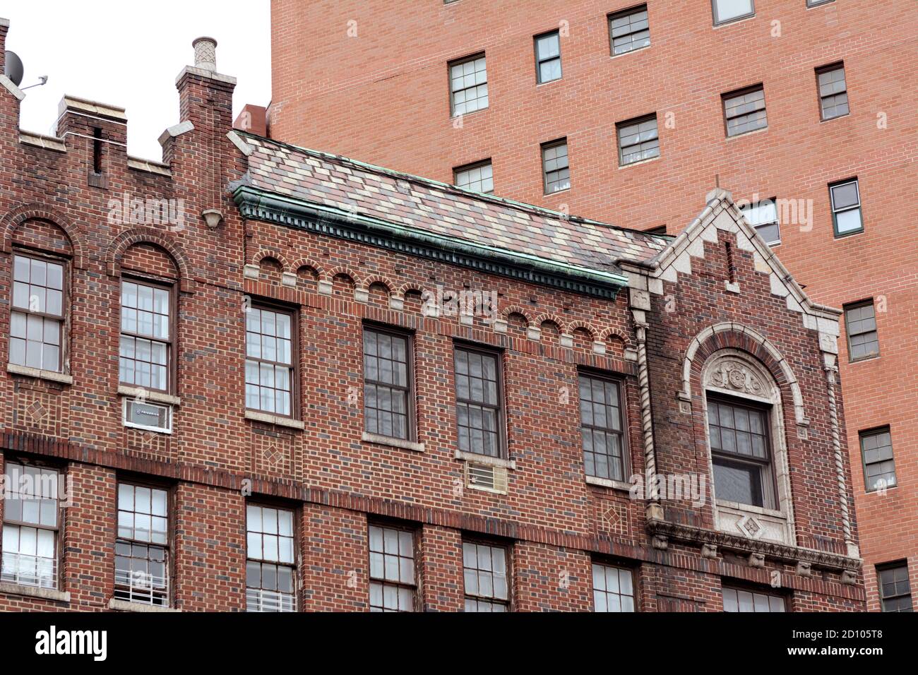 NEW YORK, USA - MAY 10, 2019: Brick apartment building with ornate exterior between Greenwich Avenue & 7th Avenue South, New York City on May 10, 2019 Stock Photo