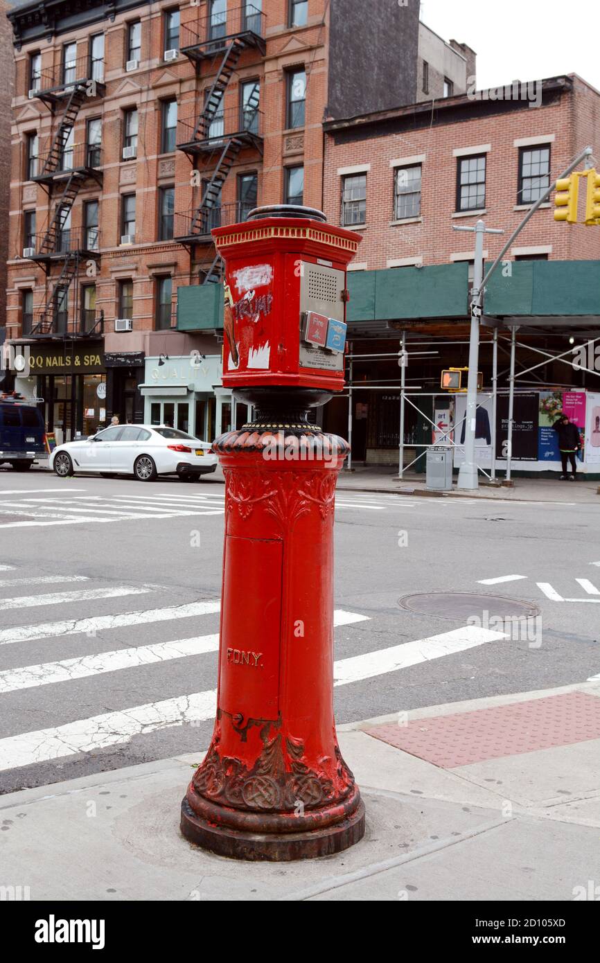 NEW YORK, USA - MAY 10, 2019: Fire alarm call box standing on the corner of Greenwich Avenue and West 10th Street in New York City on May 10, 2019. Th Stock Photo
