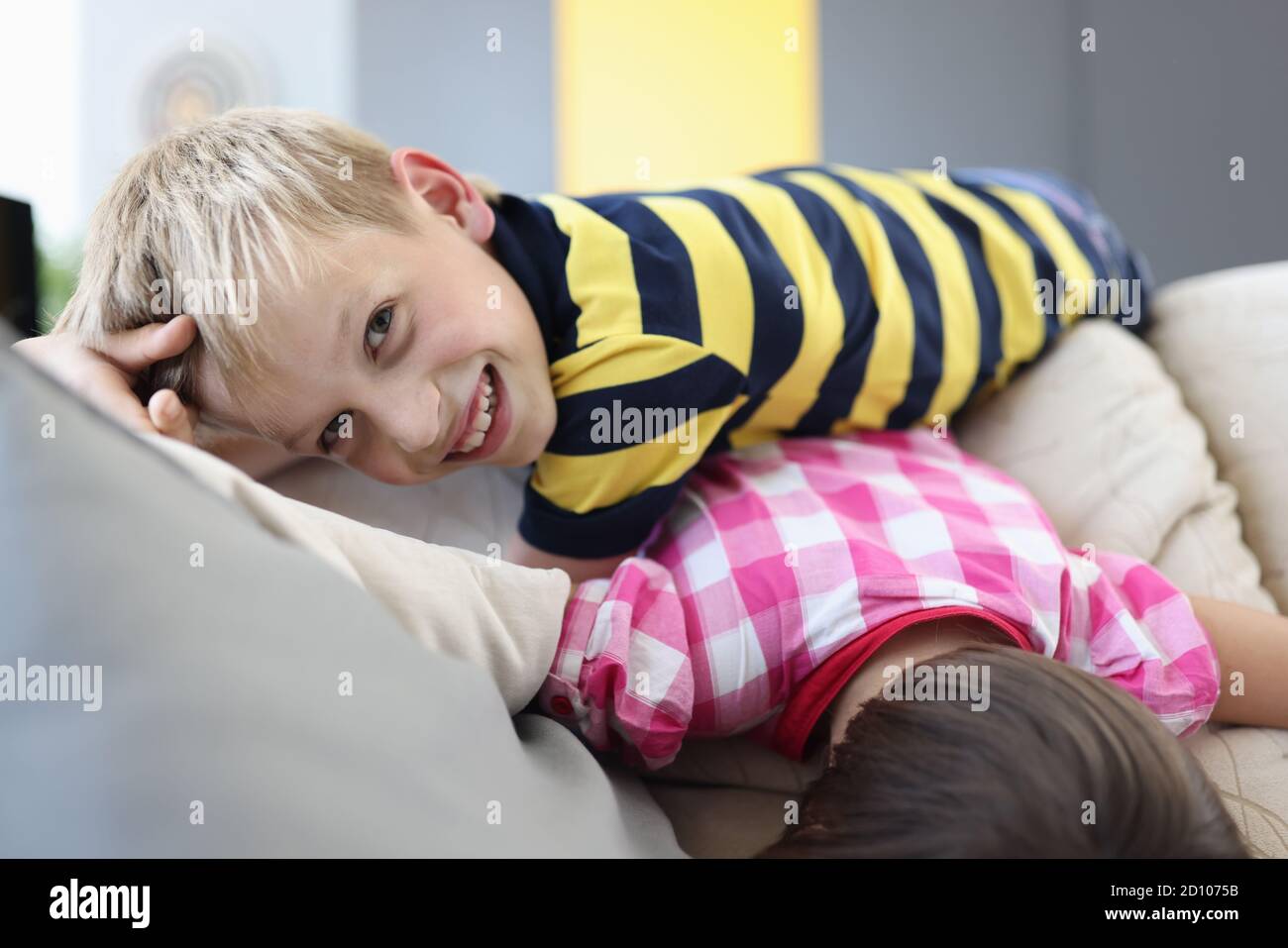 Happy children play on sofa Stock Photo Alamy