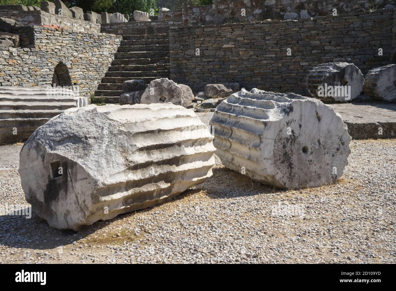 Fragments of ancient greek columns close up. The ruins of the Mausoleum at Halicarnassus, Bodrum, Turkey. Stock Photo