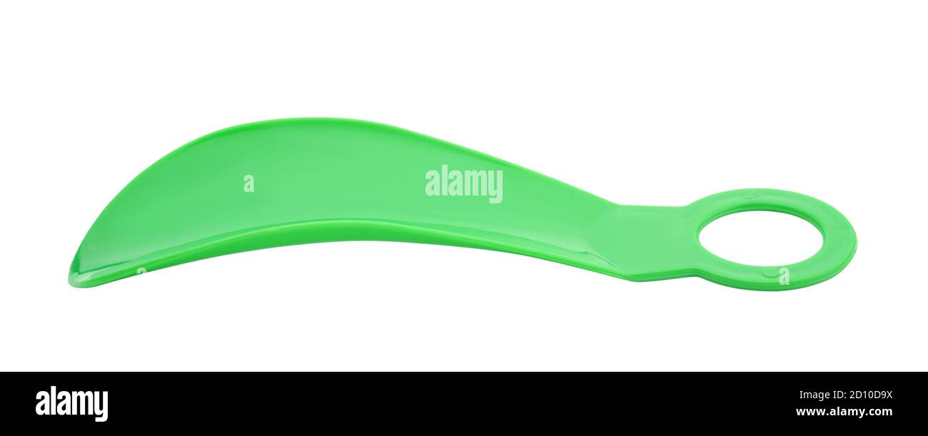 Green plastic shoe spoon isolated on white. Stock Photo