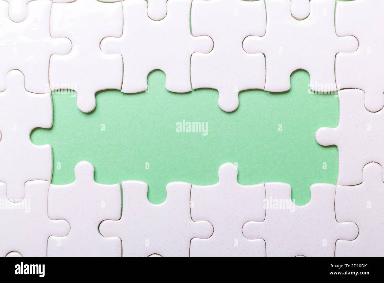 White puzzle background with pieces missing. Close-up. Copy space for text - Image Stock Photo
