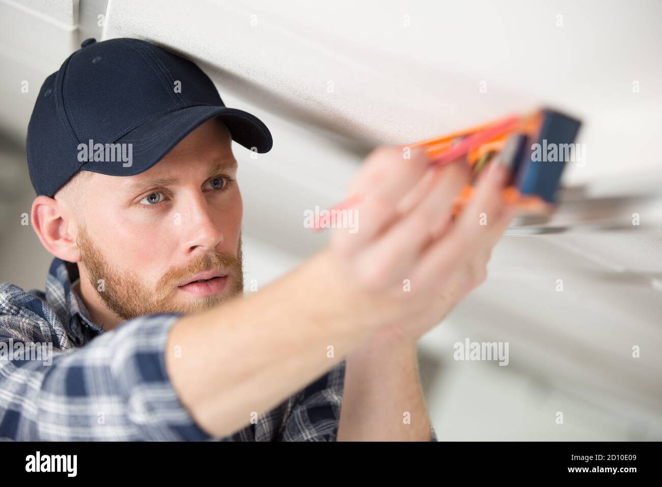 man taking measures with spirit level Stock Photo