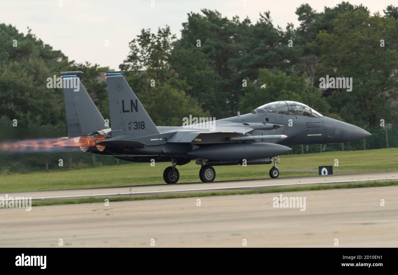 F-15E Strike Eagle, after burners lit, rolling down the runway at full power for take off Stock Photo