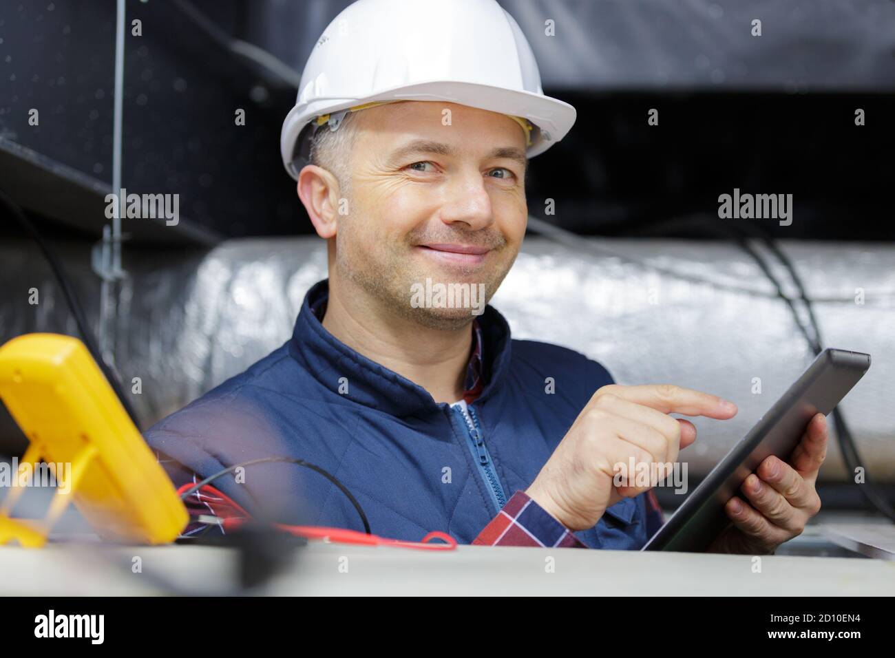 senior man installing ceiling electric circuits Stock Photo - Alamy