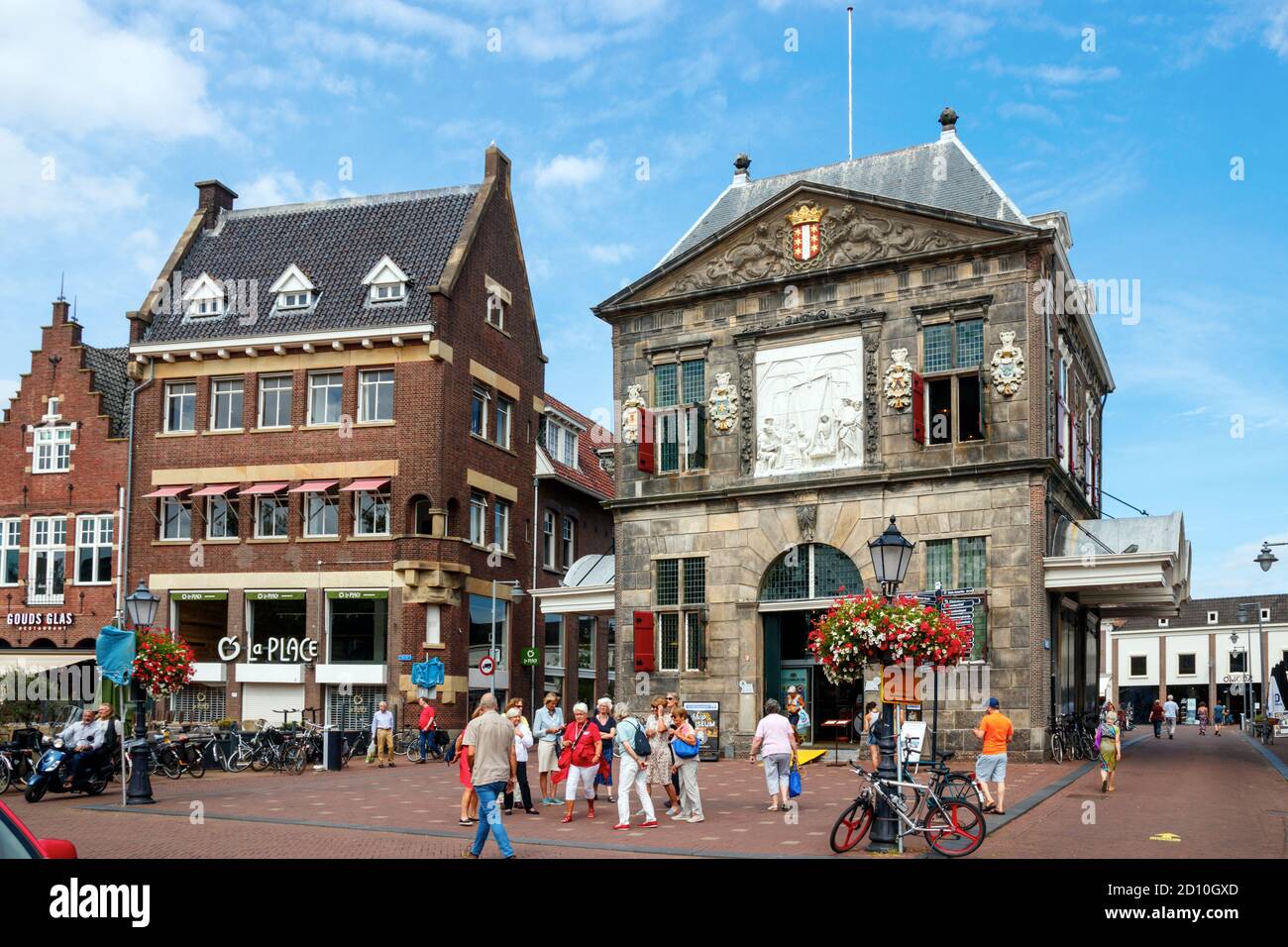 View of the Gouda old city centre. The Markt with tourists at the Goudse Waag also the cheese museum. South Holland, The Netherlands. Stock Photo