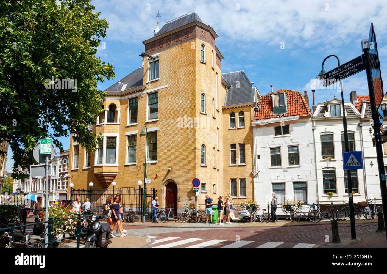 View of the Gouda old city centre. Westhaven street with the monument and former warehouse De Zon on a sunny afternoon. South Holland, The Netherlands Stock Photo