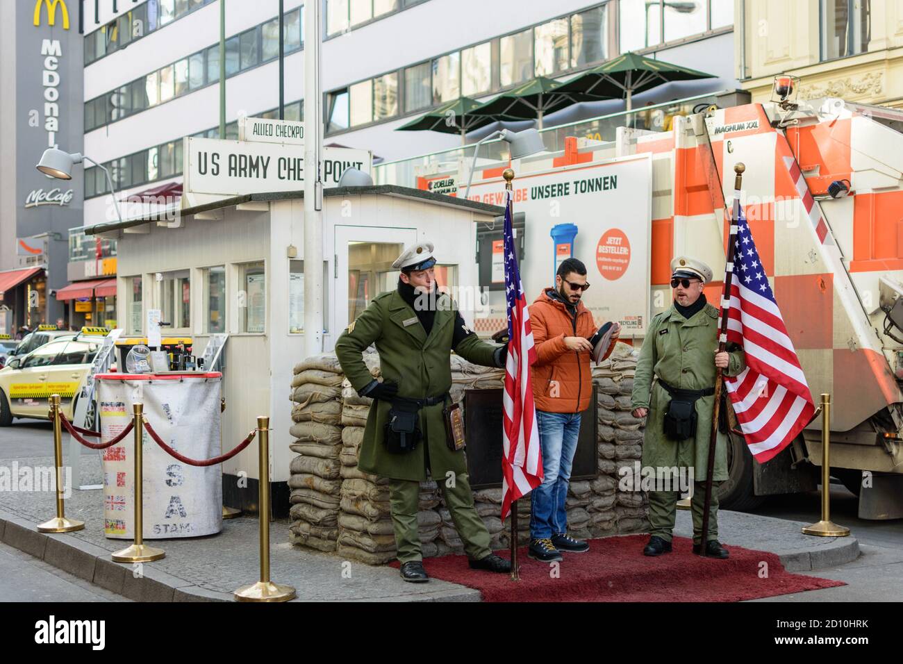 Berlin / Germany - February 15, 2017: Tourist taking photos at Checkpoint Charlie, the best-known Berlin Wall crossing point between East Berlin and W Stock Photo