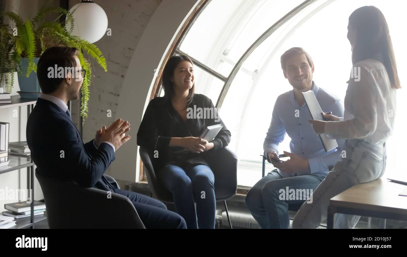 Skilled leader mentor coaching employees, leading workshop in office. Stock Photo