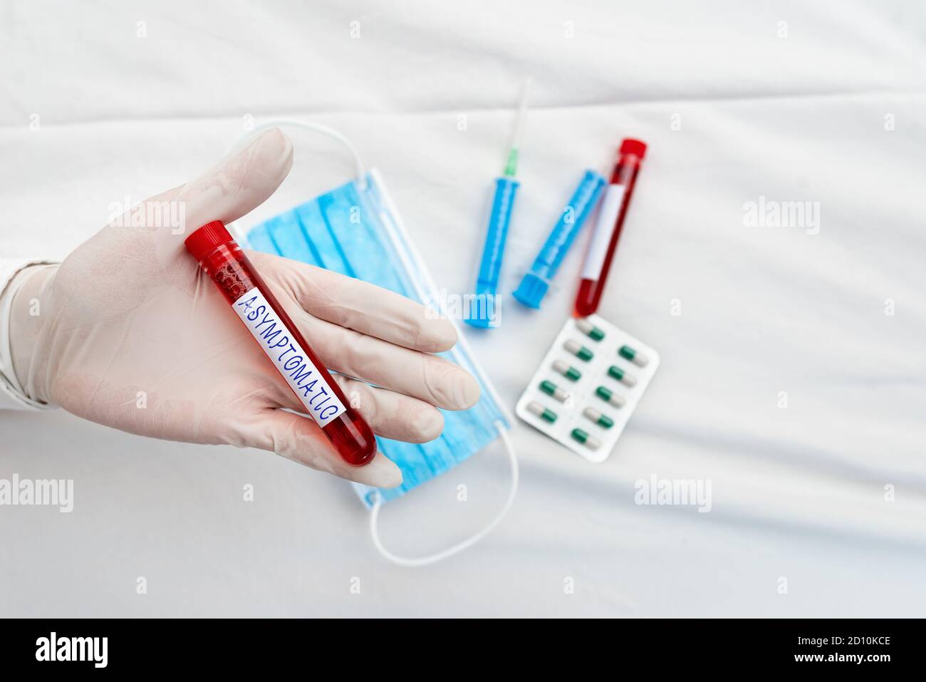 Word writing text Asymptomatic. Business photo showcasing a condition or an individual producing or showing no symptoms Extracted blood sample vial re Stock Photo