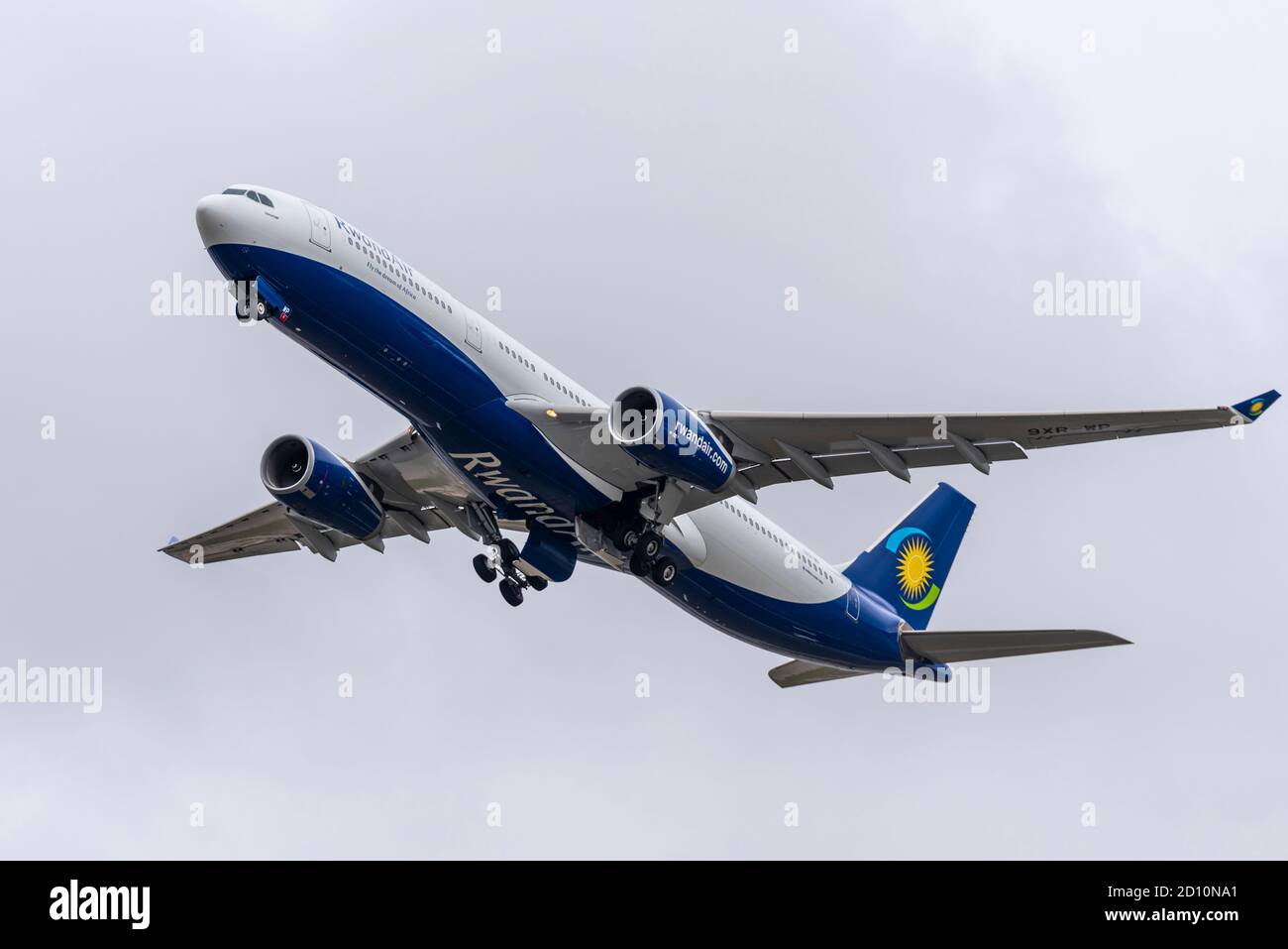 Rwandair Airbus A330 -300 jet airliner plane 9XR-WP taking off in bad weather from London Heathrow Airport, UK. Flag carrier airline of Rwanda Stock Photo