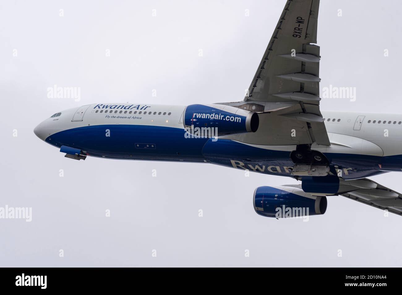 Rwandair Airbus A330 -300 jet airliner plane 9XR-WP taking off in bad weather from London Heathrow Airport, UK. Flag carrier airline of Rwanda Stock Photo