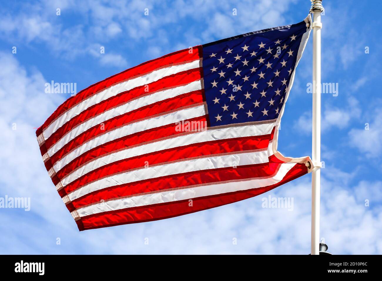 American flag with beautiful blue sky and white clouds Stock Photo - Alamy