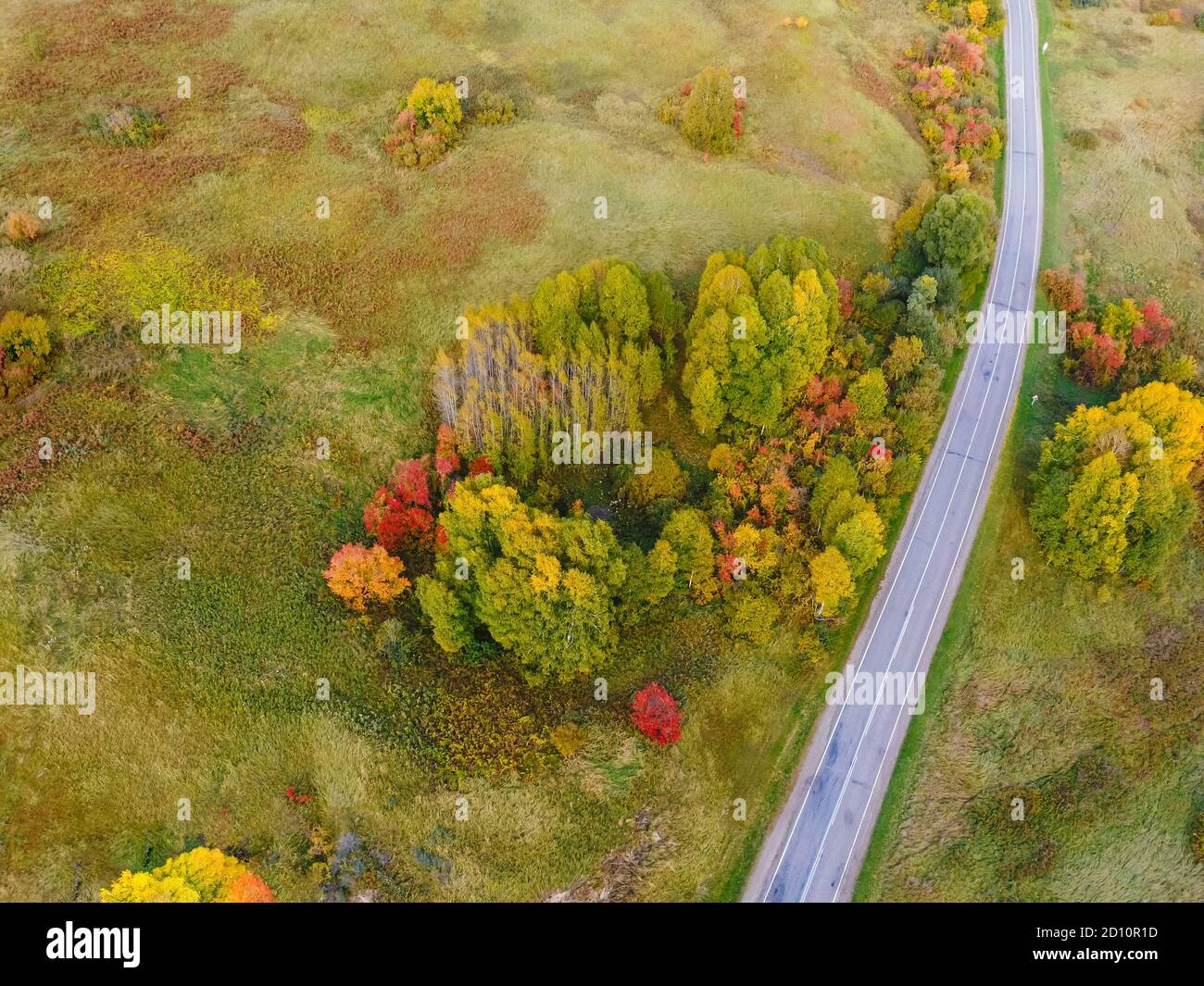 Aerial view of the road with a picturesque autumn landscape. Top view Stock Photo