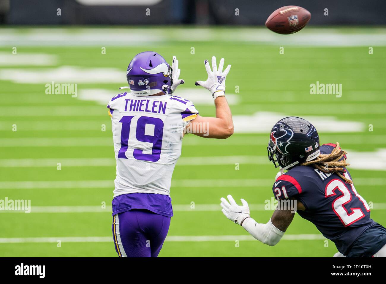 Houston, TX, USA. 4th Oct, 2020. Minnesota Vikings wide receiver Adam Thielen (19) makes a catch while being defended by Houston Texans cornerback Bradley Roby (21) during the 2nd quarter of an NFL football game between the Minnesota Vikings and the Houston Texans at NRG Stadium in Houston, TX. Trask Smith/CSM/Alamy Live News Stock Photo