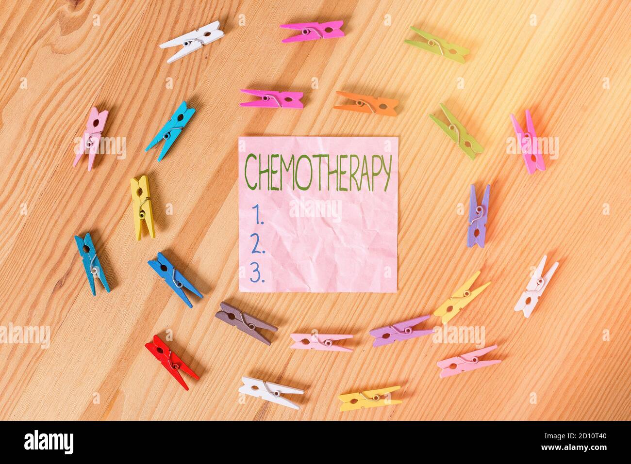 Conceptual hand writing showing Chemotherapy. Concept meaning treatment of disease used chemical substances for cancer Colored crumpled papers wooden Stock Photo