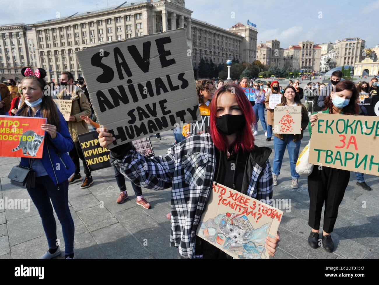 Activist holding animal rights placards during a rally marking World Animal rights activists demand a ban on euthanasia of stray animals, hunting, animal testing of cosmetics and household chemicals, and the Activist holding animal rights placards during a rally marking World Animal rights activists demand a ban on euthanasia of stray animals, hunting, animal testing of cosmetics and household chemicals, and the