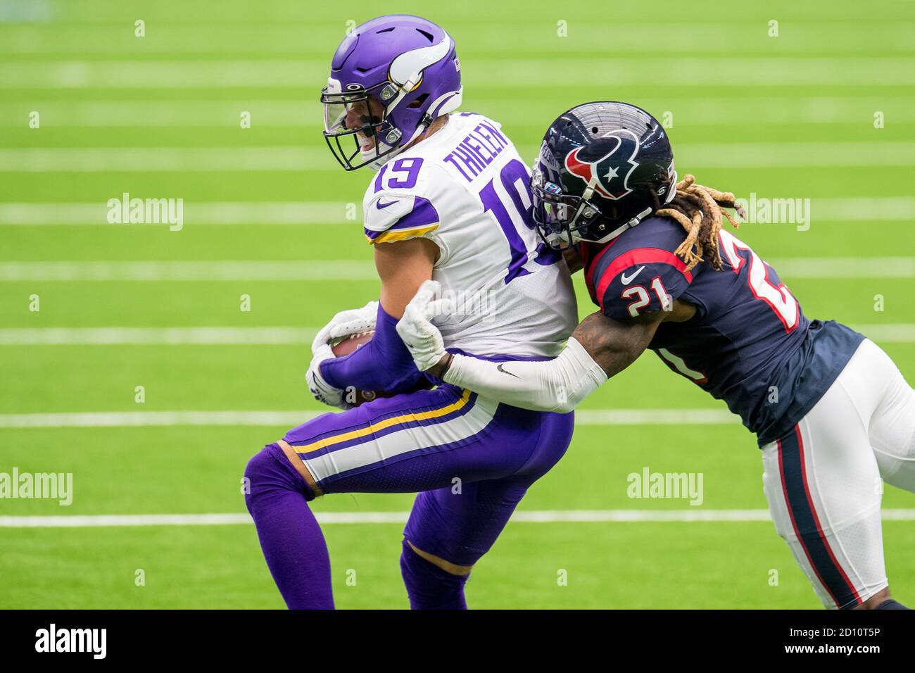 Houston, TX, USA. 4th Oct, 2020. Minnesota Vikings wide receiver Adam Thielen (19) makes a catch while being defended by Houston Texans cornerback Bradley Roby (21) during the 2nd quarter of an NFL football game between the Minnesota Vikings and the Houston Texans at NRG Stadium in Houston, TX. Trask Smith/CSM/Alamy Live News Stock Photo